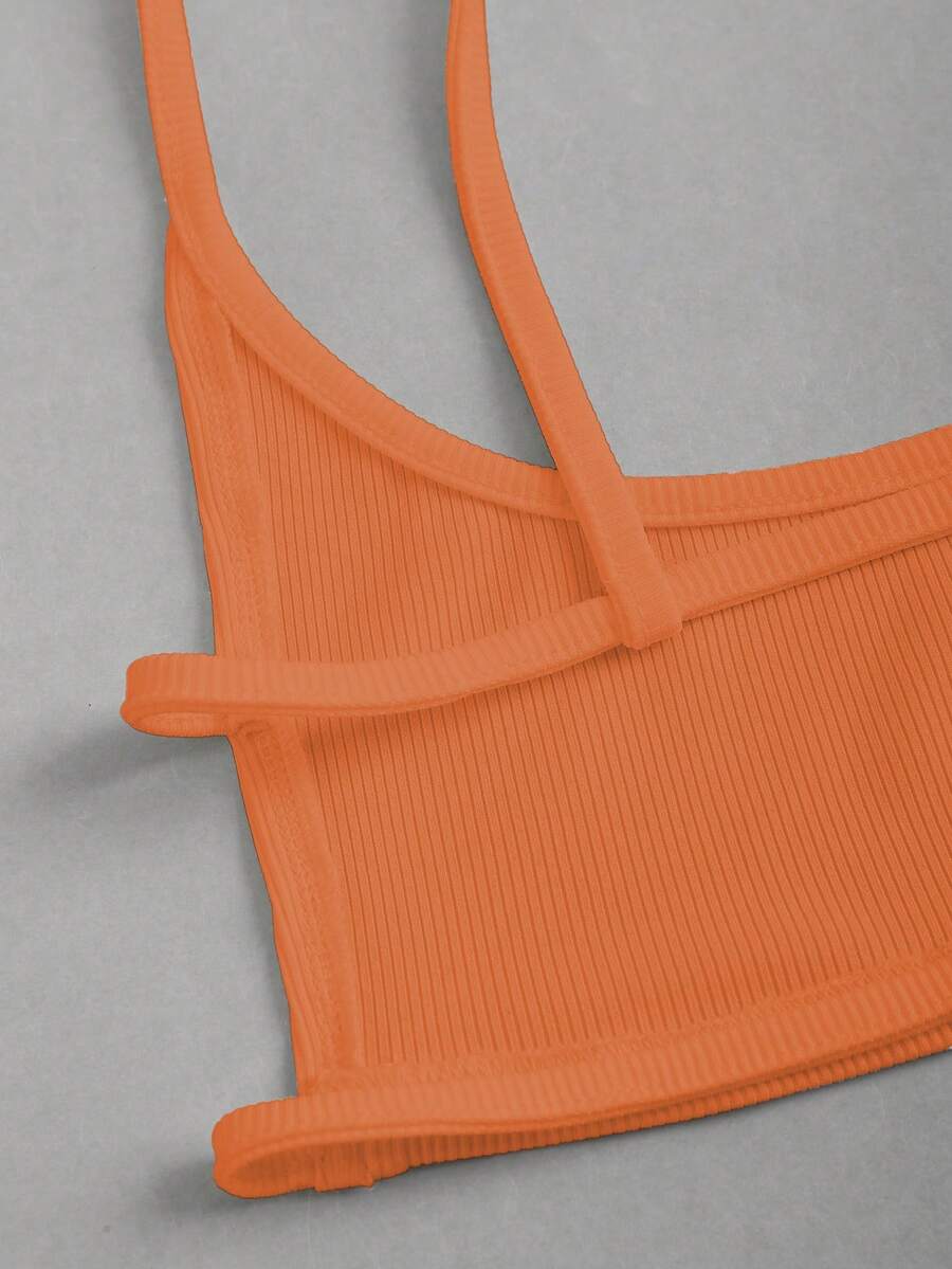 Women's black cropped camisole top with faux crocodile texture, backless spaghetti straps, and matching arm sleeves.