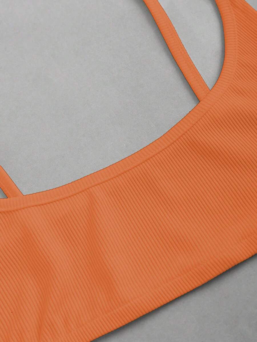 Women's black cropped camisole top with faux crocodile texture, backless spaghetti straps, and matching arm sleeves.