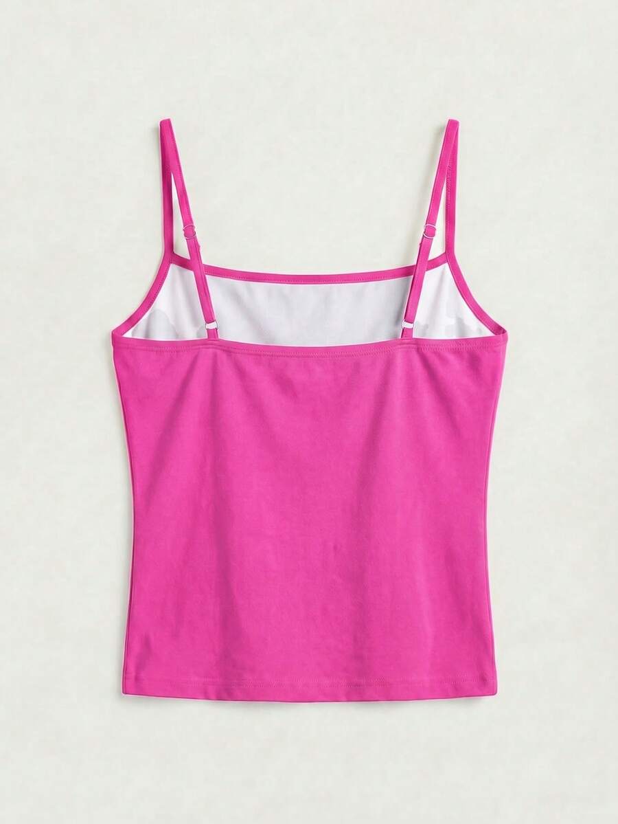 Women's blue floral print spaghetti strap camisole top in a slim fit short length design