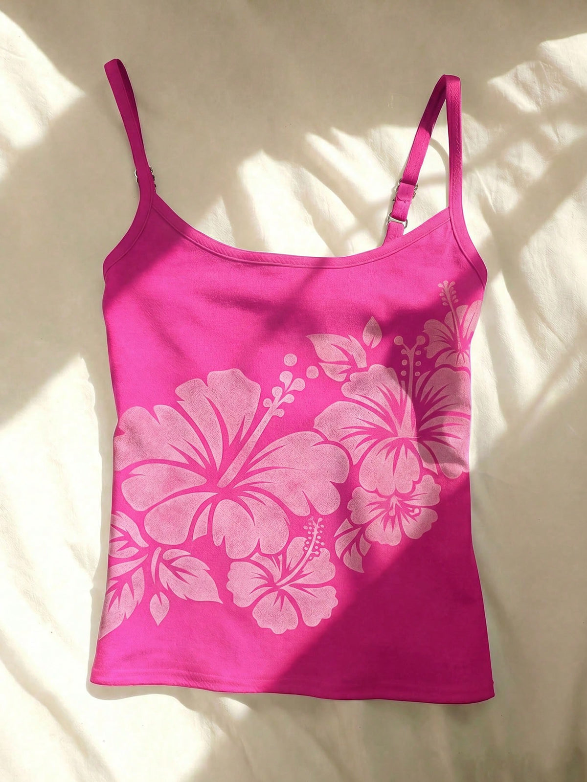 Women's blue floral print spaghetti strap camisole top in a slim fit short length design