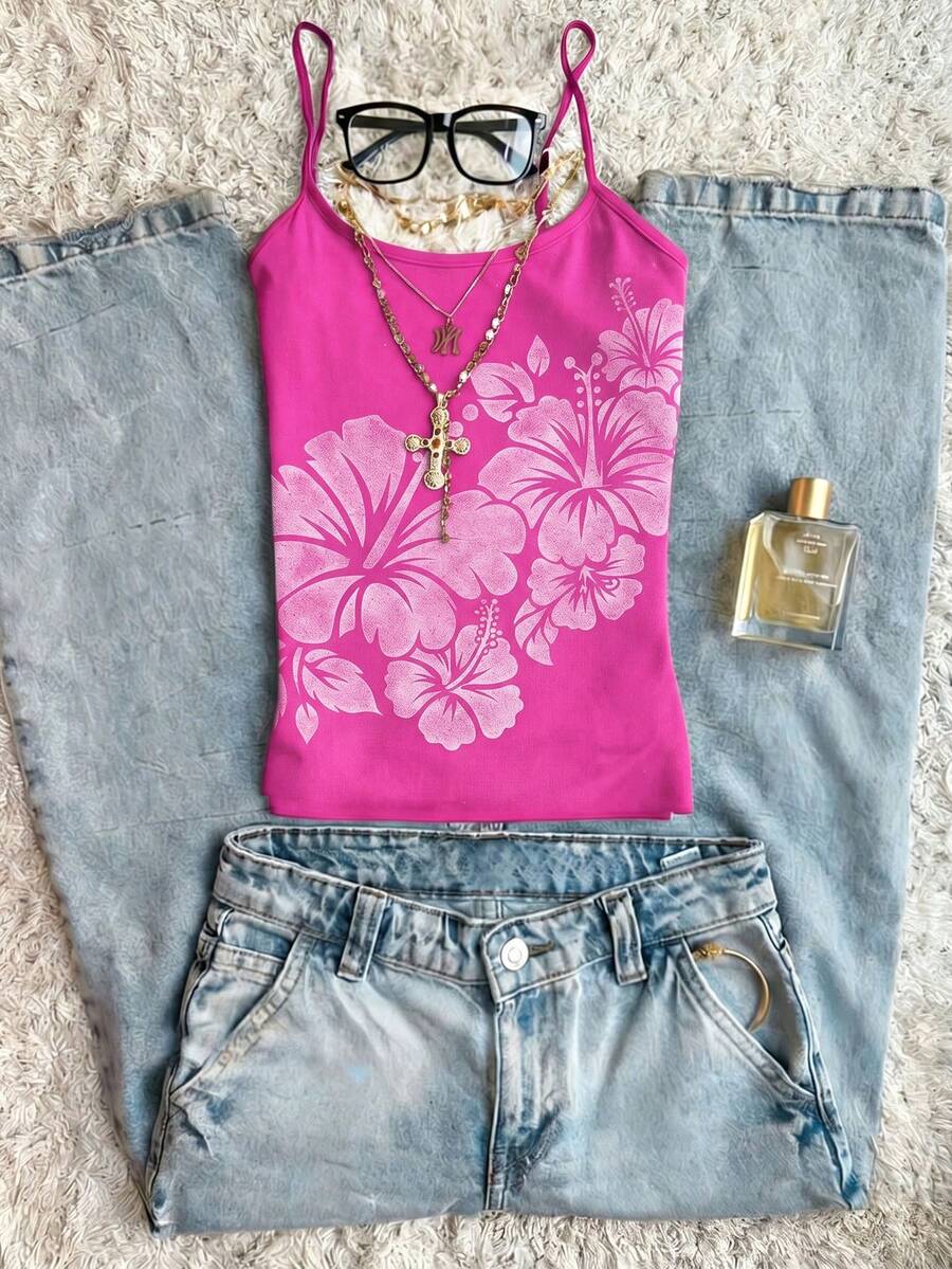 Women's blue floral print spaghetti strap camisole top in a slim fit short length design
