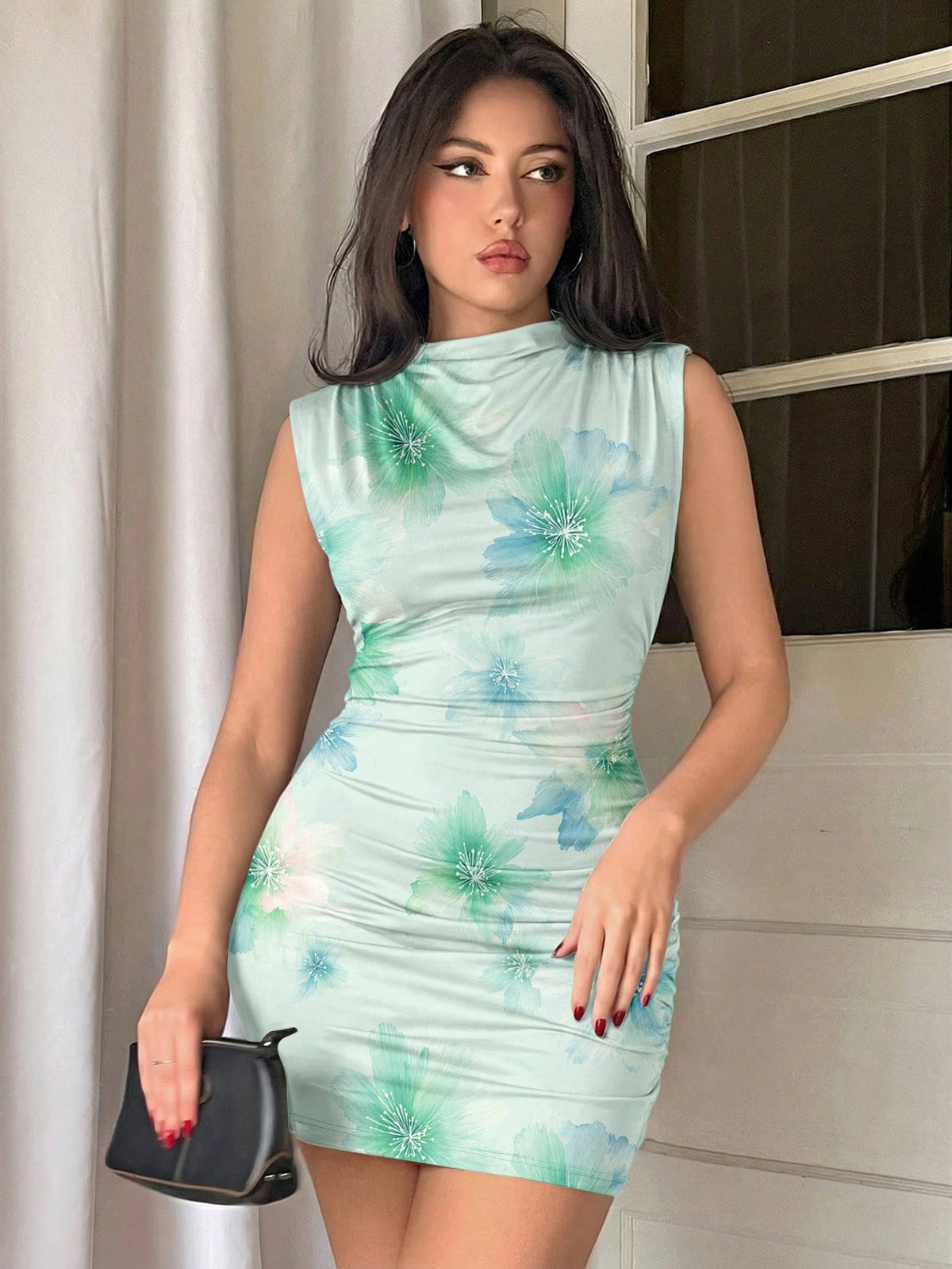 Army green sleeveless bodycon mini dress with a stand collar, ruched details, and zipper back.