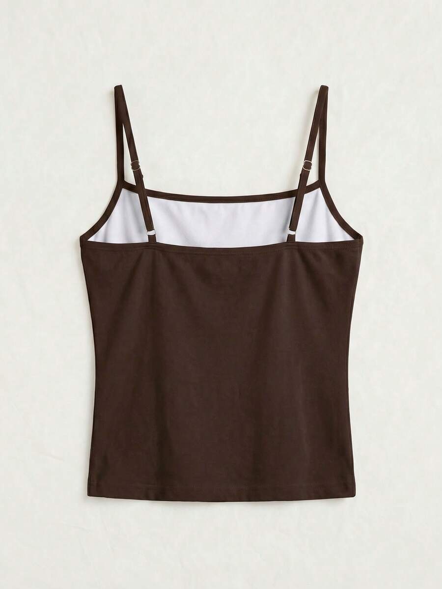 Women's blue floral print spaghetti strap camisole top in a slim fit short length design