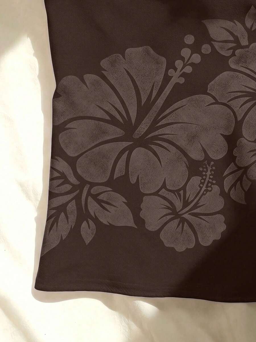 Women's blue floral print spaghetti strap camisole top in a slim fit short length design