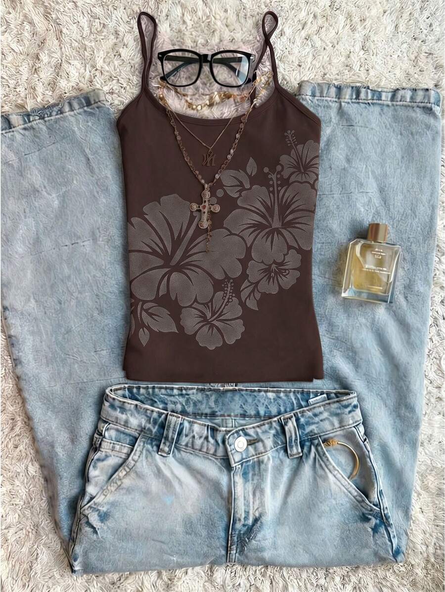 Women's blue floral print spaghetti strap camisole top in a slim fit short length design