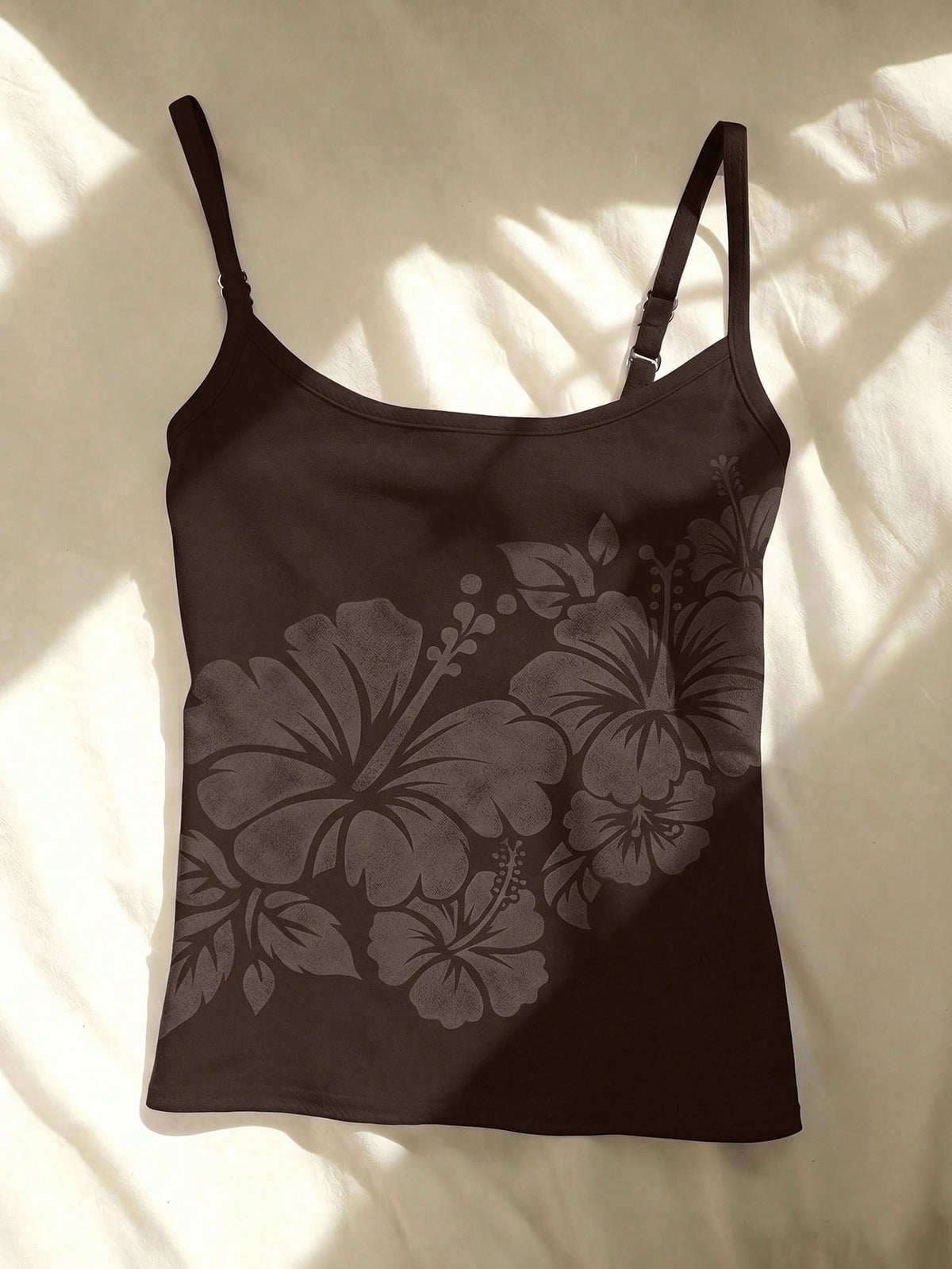 Women's blue floral print spaghetti strap camisole top in a slim fit short length design