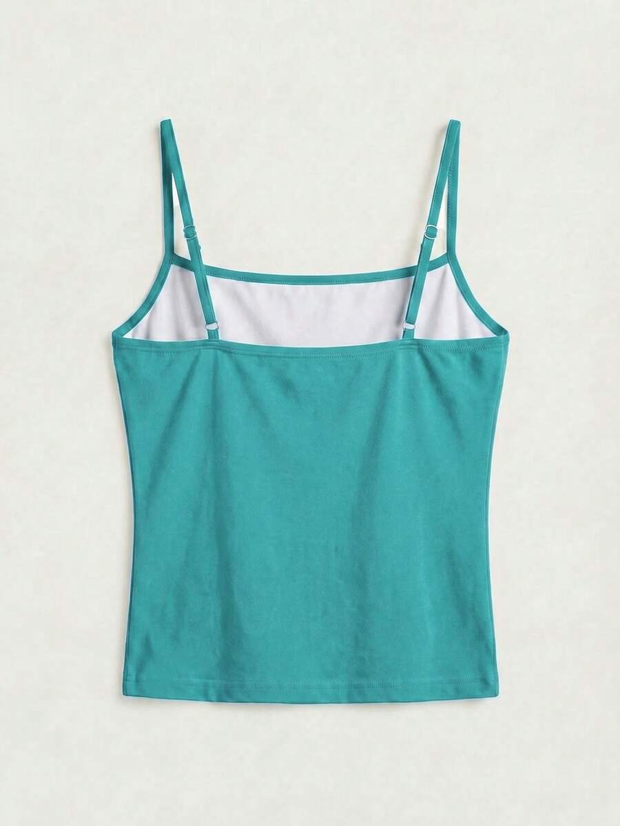 Women's blue floral print spaghetti strap camisole top in a slim fit short length design