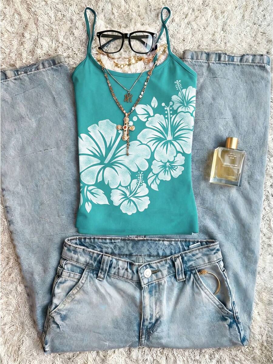 Women's blue floral print spaghetti strap camisole top in a slim fit short length design