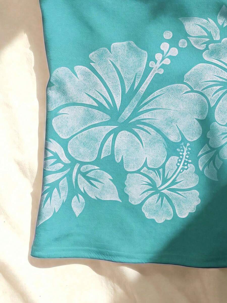 Women's blue floral print spaghetti strap camisole top in a slim fit short length design