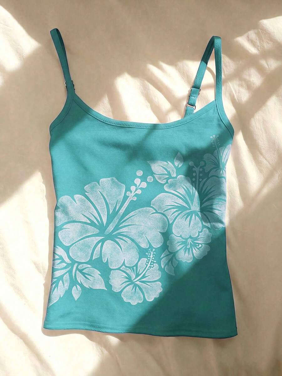 Women's blue floral print spaghetti strap camisole top in a slim fit short length design