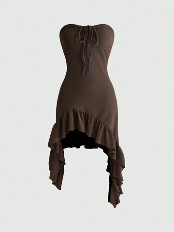 Women's brown spaghetti strap cami mini dress featuring a slim fit bodycon silhouette with an asymmetrical knot ruffle hem.