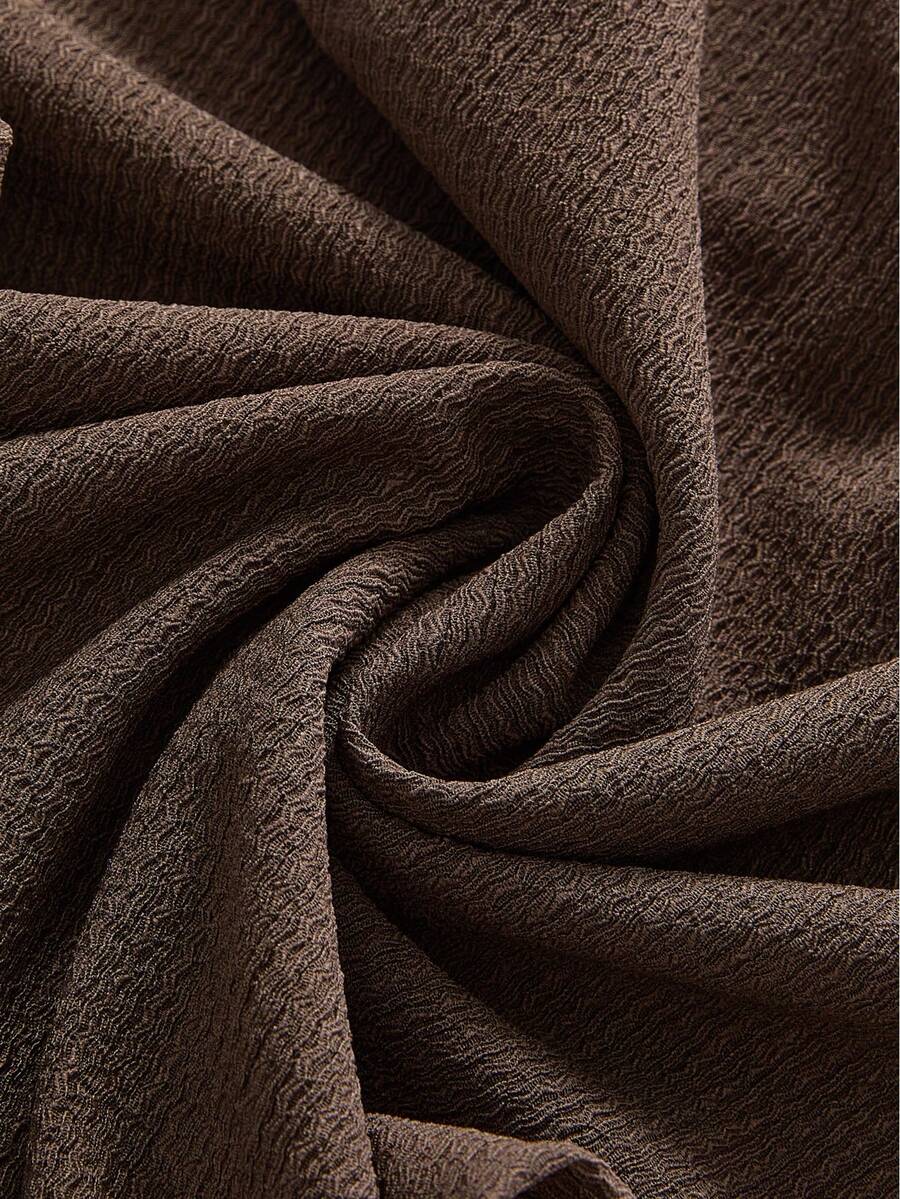 Women's brown spaghetti strap cami mini dress featuring a slim fit bodycon silhouette with an asymmetrical knot ruffle hem.