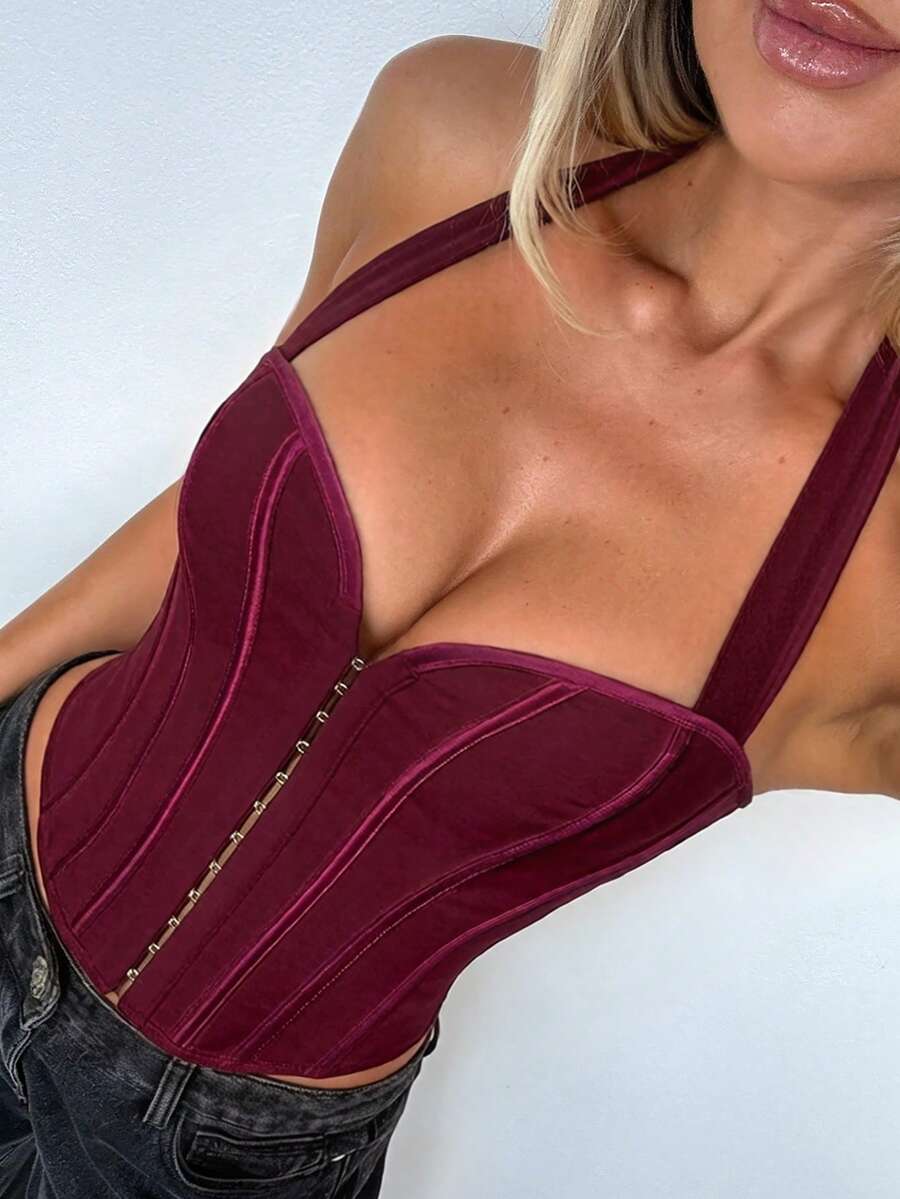White Y2K halter backless corset top featuring lace-up back detail and metal grommet eyelets for women