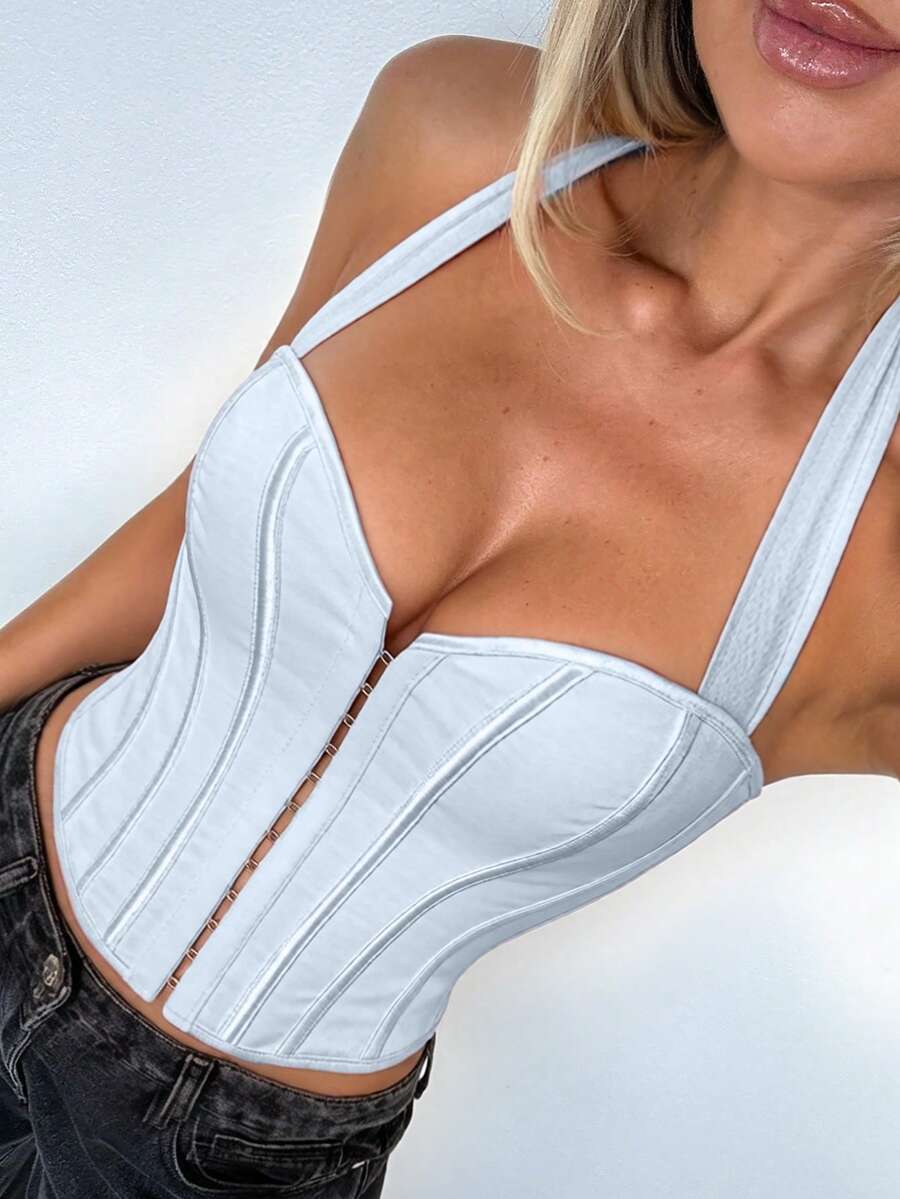 White Y2K halter backless corset top featuring lace-up back detail and metal grommet eyelets for women