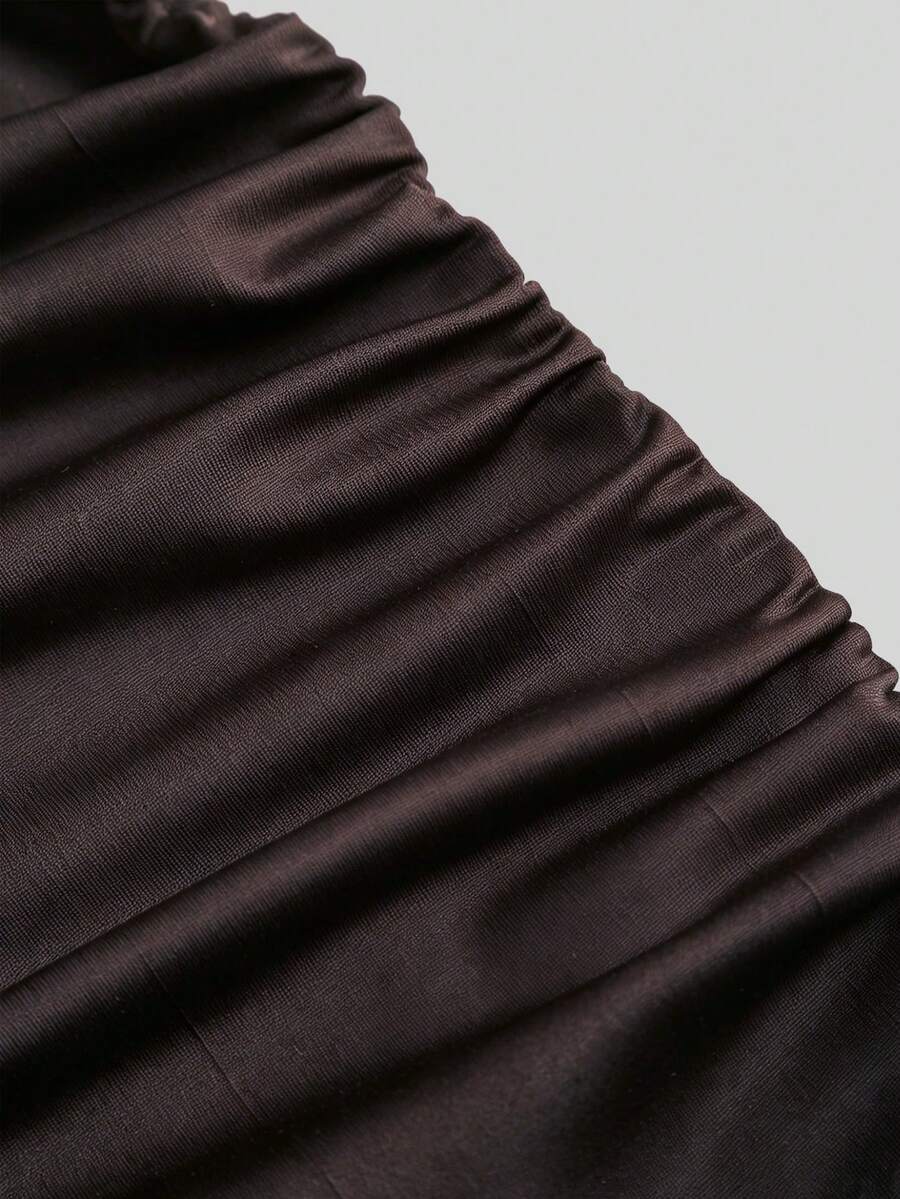 Women's black strapless lace patchwork bodycon mini dress featuring a slim fit design and an asymmetrical hem.