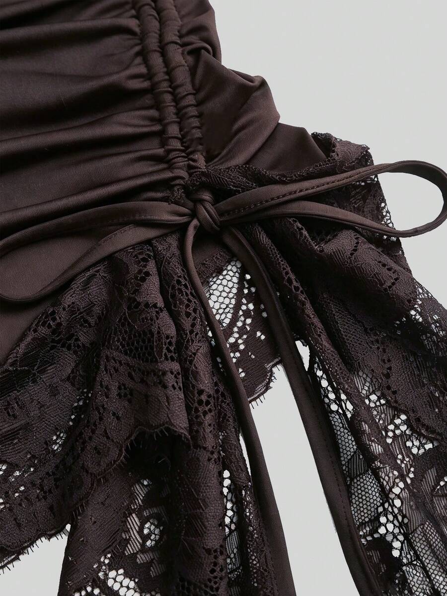 Women's black strapless lace patchwork bodycon mini dress featuring a slim fit design and an asymmetrical hem.