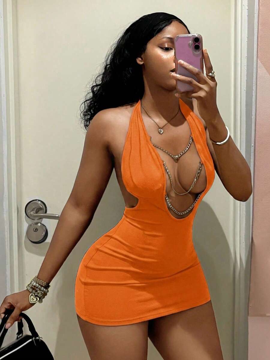 Women's black deep V-neck halter bodycon mini dress featuring a backless design with chain decor detail.