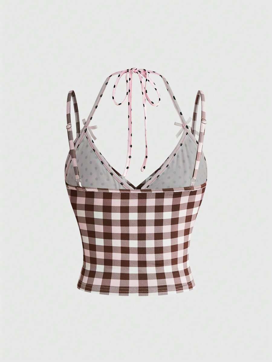Women's multicolor plaid crop cami top featuring thin spaghetti straps, a front bow detail, and a slim fit knit design.