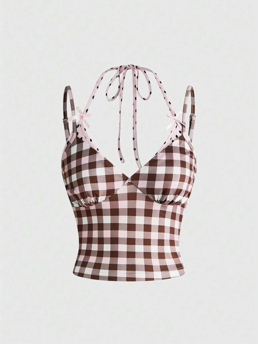 Women's multicolor plaid crop cami top featuring thin spaghetti straps, a front bow detail, and a slim fit knit design.