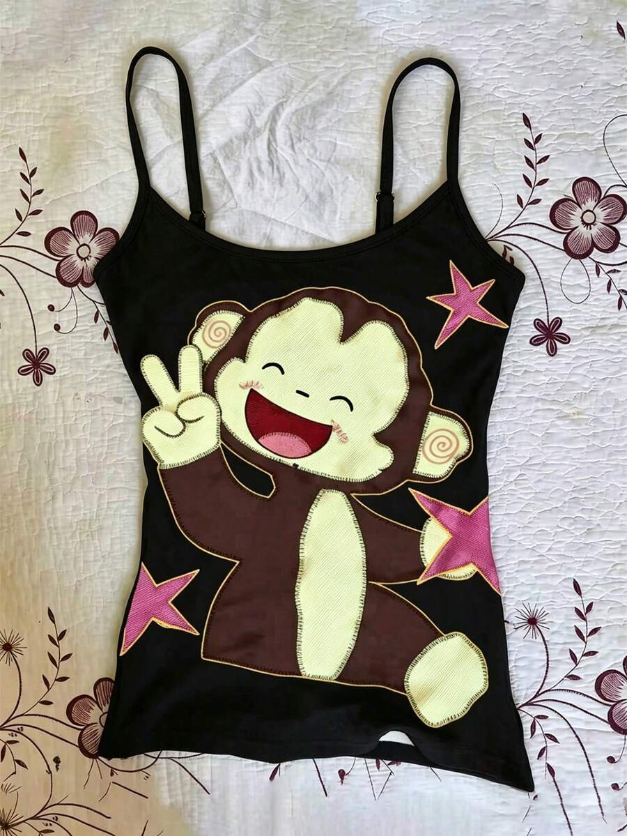 Burgundy cross pattern camisole top featuring spaghetti straps, ring accent, and a backless slim fit design.