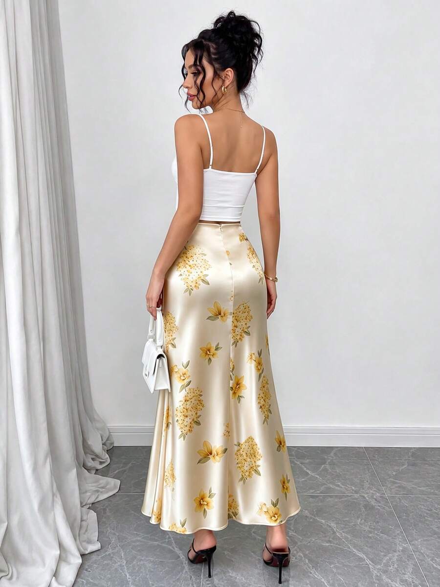Women's elegant black A-line long skirt featuring a plain woven fabric, regular fit, natural mid-waist style, and flared hem design suitable for formal and evening wear.