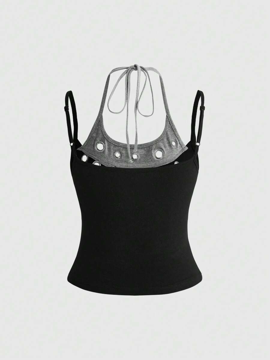Black halter crop tank top featuring lace-up front details, ruched texture, eye appliques, and matching detached arm sleeves.