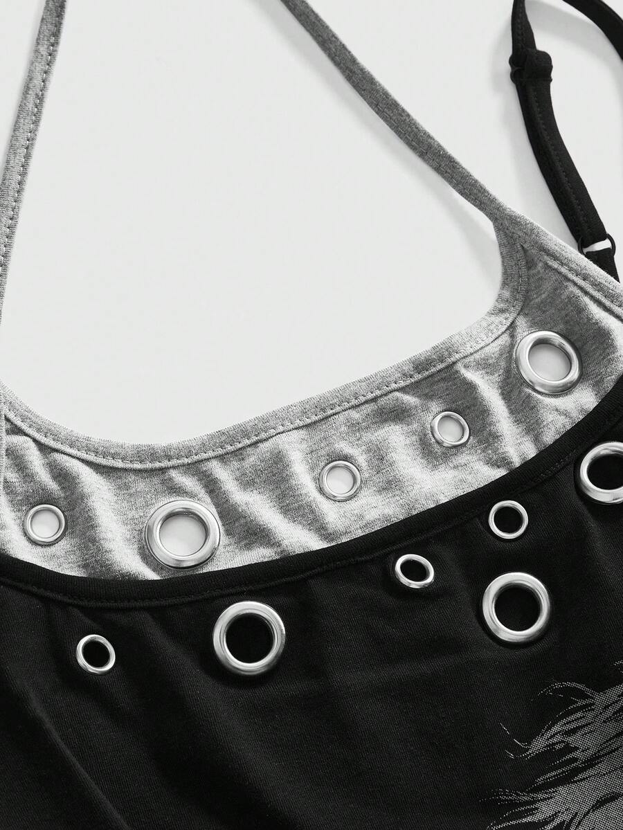 Black halter crop tank top featuring lace-up front details, ruched texture, eye appliques, and matching detached arm sleeves.