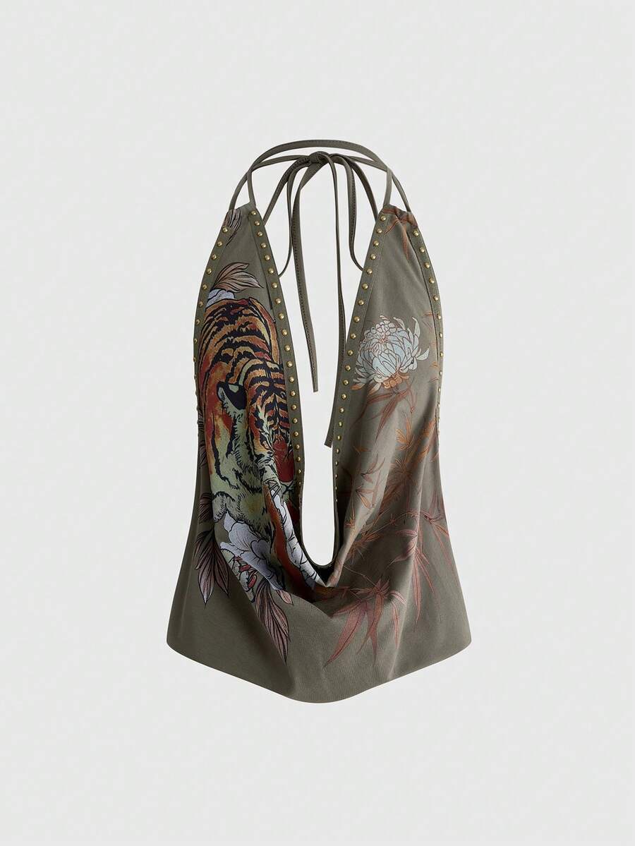 Front view of women's black halter tank top featuring graphic print, rhinestone embellishments, and a backless tie-back design.