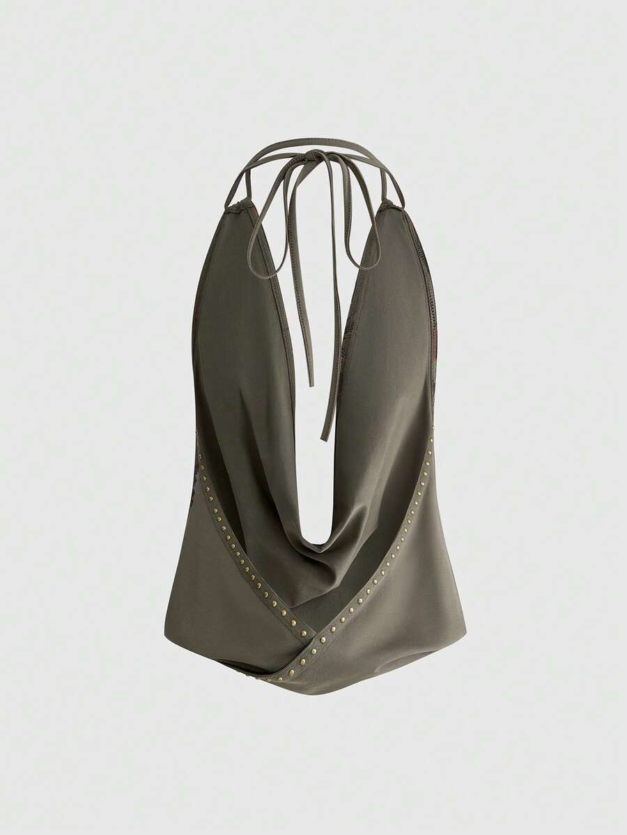 Front view of women's black halter tank top featuring graphic print, rhinestone embellishments, and a backless tie-back design.
