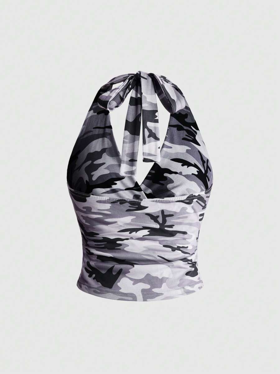Women's halter crop tank top featuring a backless silhouette and ruched detailing in a slim fit design.