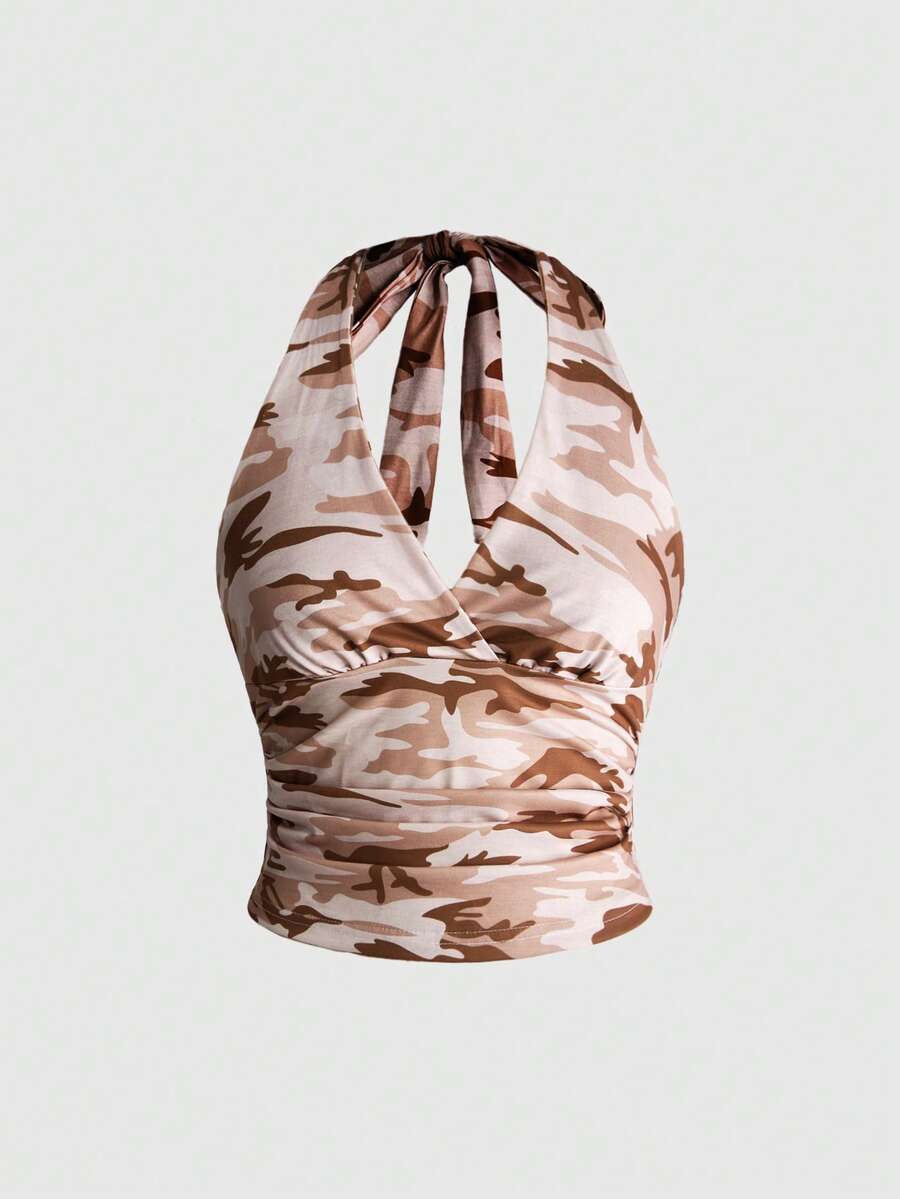 Women's halter crop tank top featuring a backless silhouette and ruched detailing in a slim fit design.