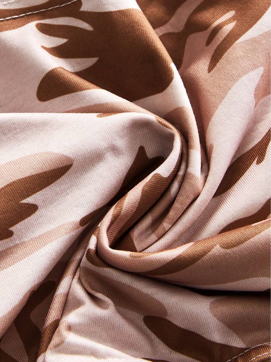 Women's halter crop tank top featuring a backless silhouette and ruched detailing in a slim fit design.