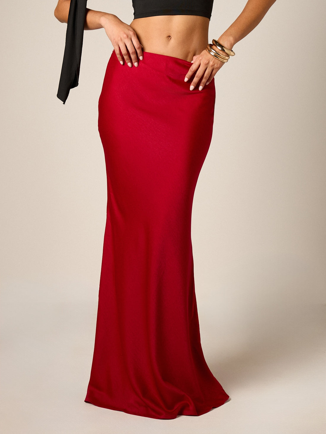 Red satin maxi skirt for women featuring an elegant mid-waist mermaid fit and flared hem