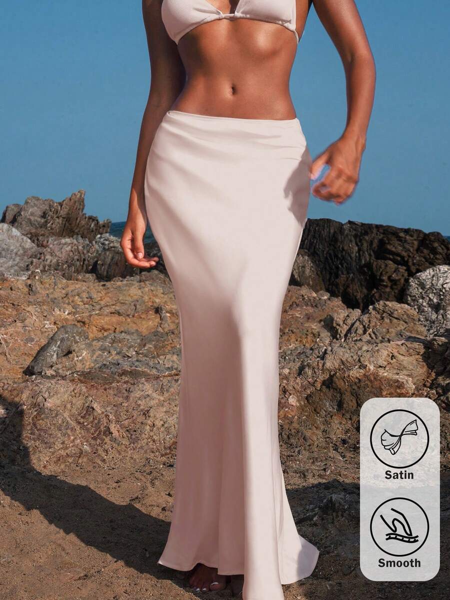Women's black woven mermaid maxi skirt featuring a solid color design, mid waist, and 100% cotton fabric.