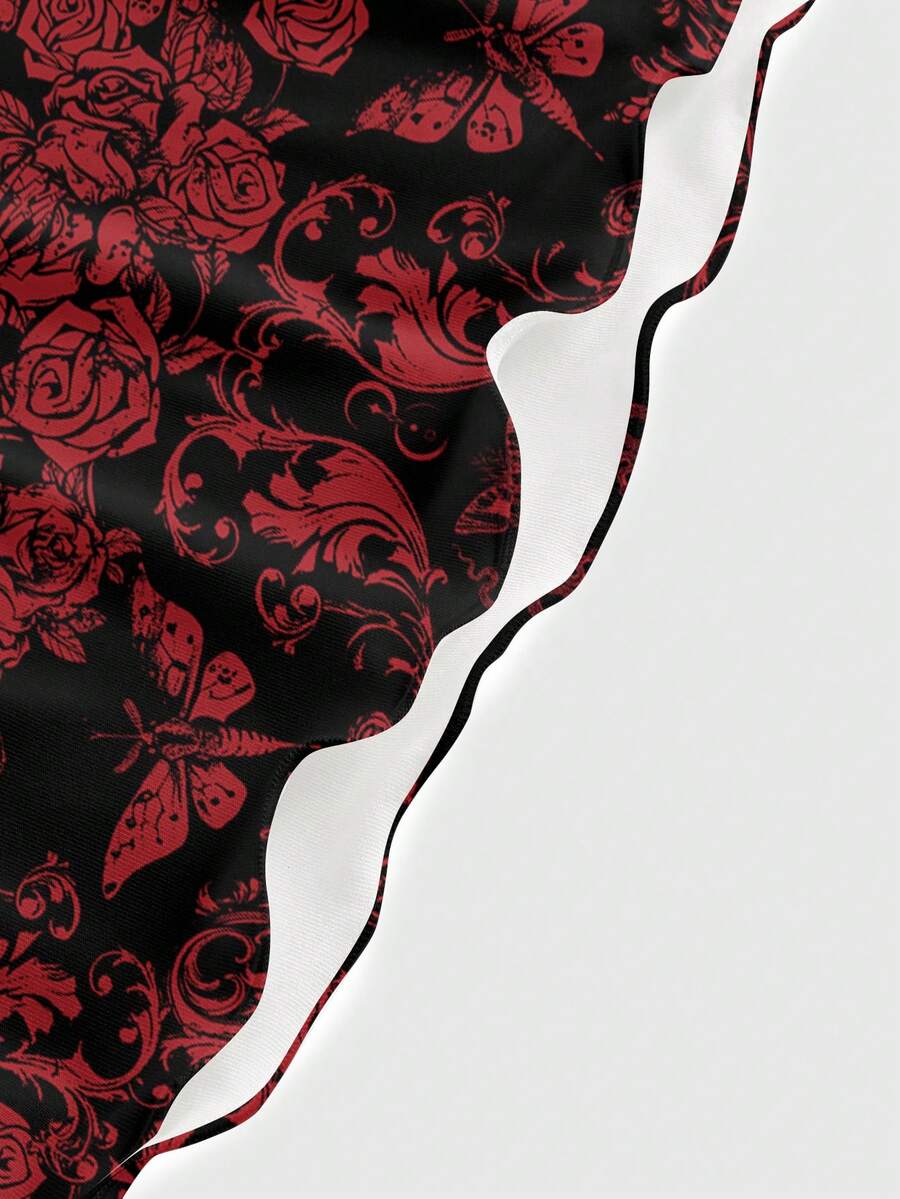 Women wearing a black gothic skull print backless cami mini dress with spaghetti straps and lettuce trim hem.