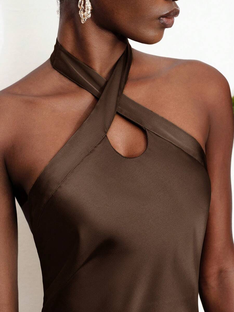 Women's black satin halter neck bodycon midi dress featuring a sleeveless backless design with front slit hem and wrap details.