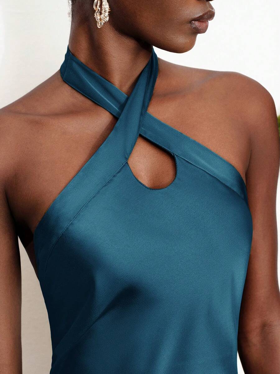 Women's black satin halter neck bodycon midi dress featuring a sleeveless backless design with front slit hem and wrap details.