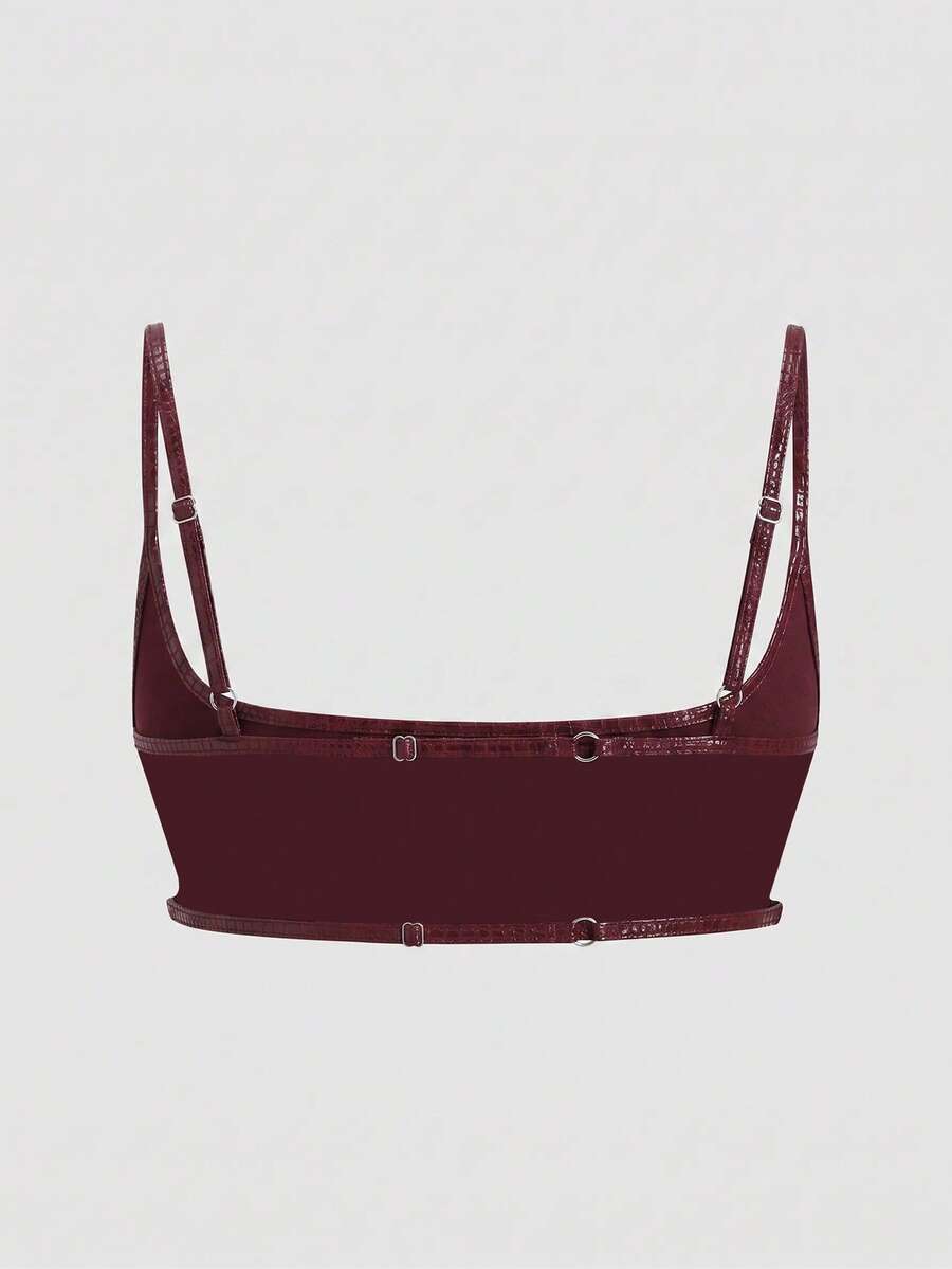 Women's black cropped camisole top with faux crocodile texture, backless spaghetti straps, and matching arm sleeves.