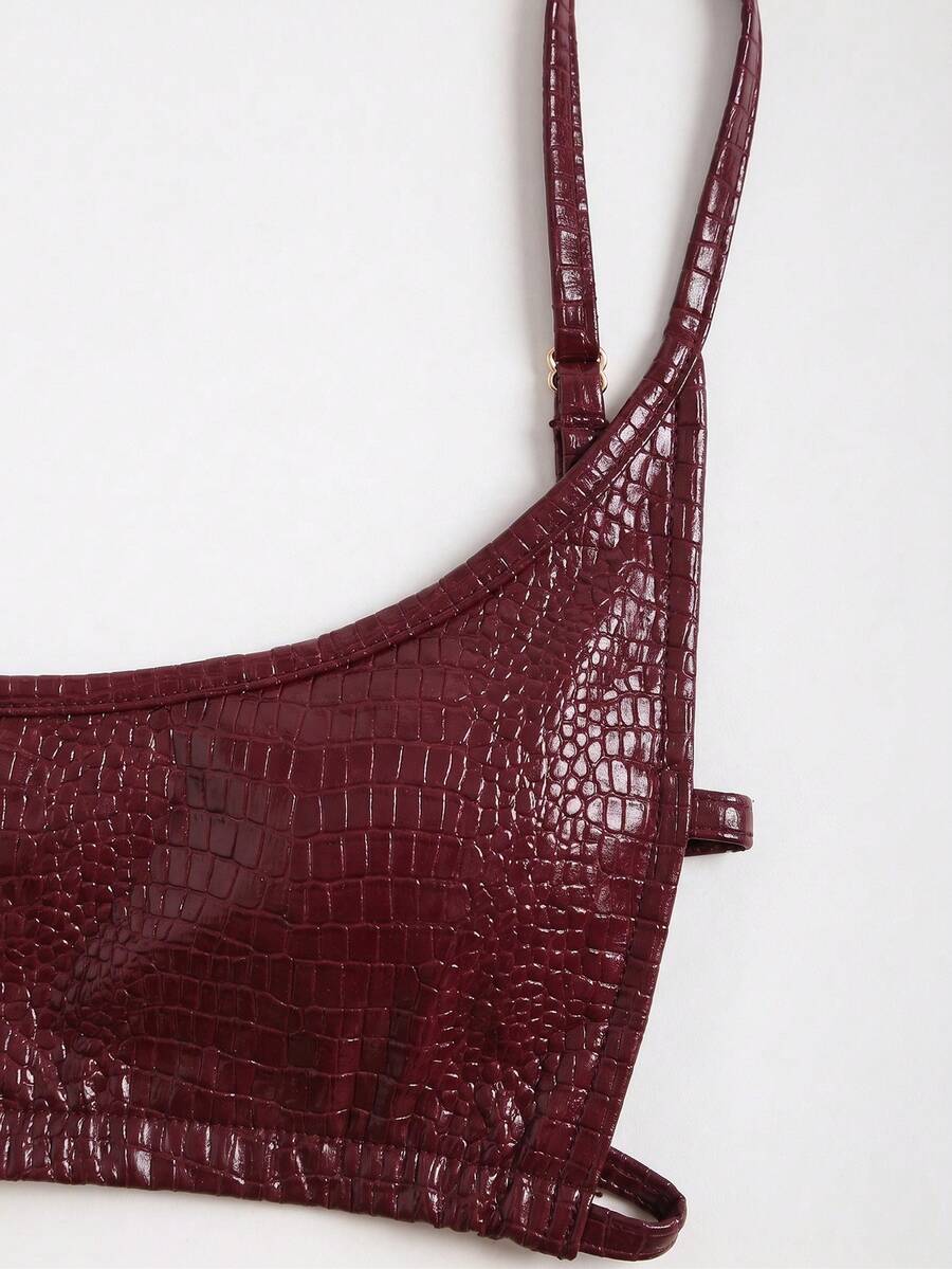 Women's black cropped camisole top with faux crocodile texture, backless spaghetti straps, and matching arm sleeves.