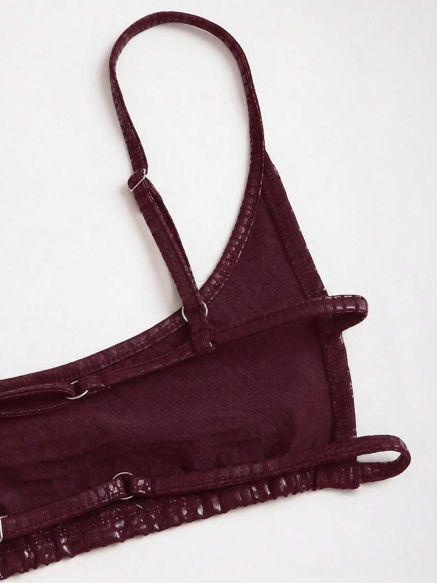 Women's black cropped camisole top with faux crocodile texture, backless spaghetti straps, and matching arm sleeves.