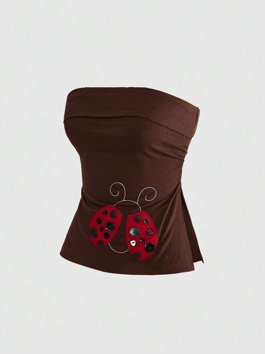 Women's black cropped strapless camisole top with ladybug embroidery and rhinestone details.