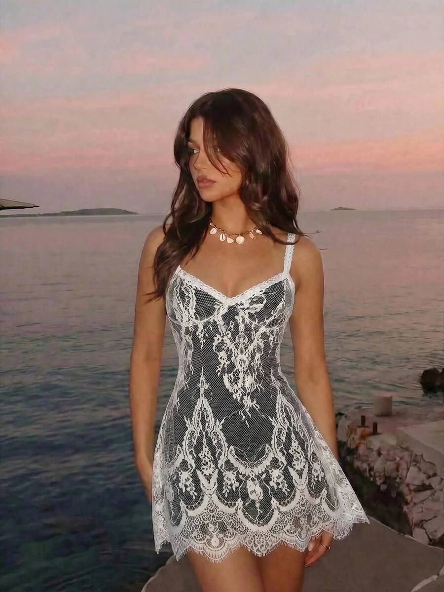 Skyraze women's lace waist-cinching cami dress featuring spaghetti straps, a high waist, and slim fit design.