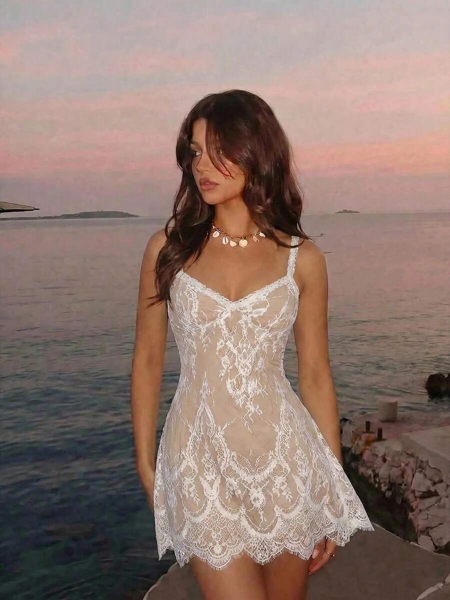 Skyraze women's lace waist-cinching cami dress featuring spaghetti straps, a high waist, and slim fit design.