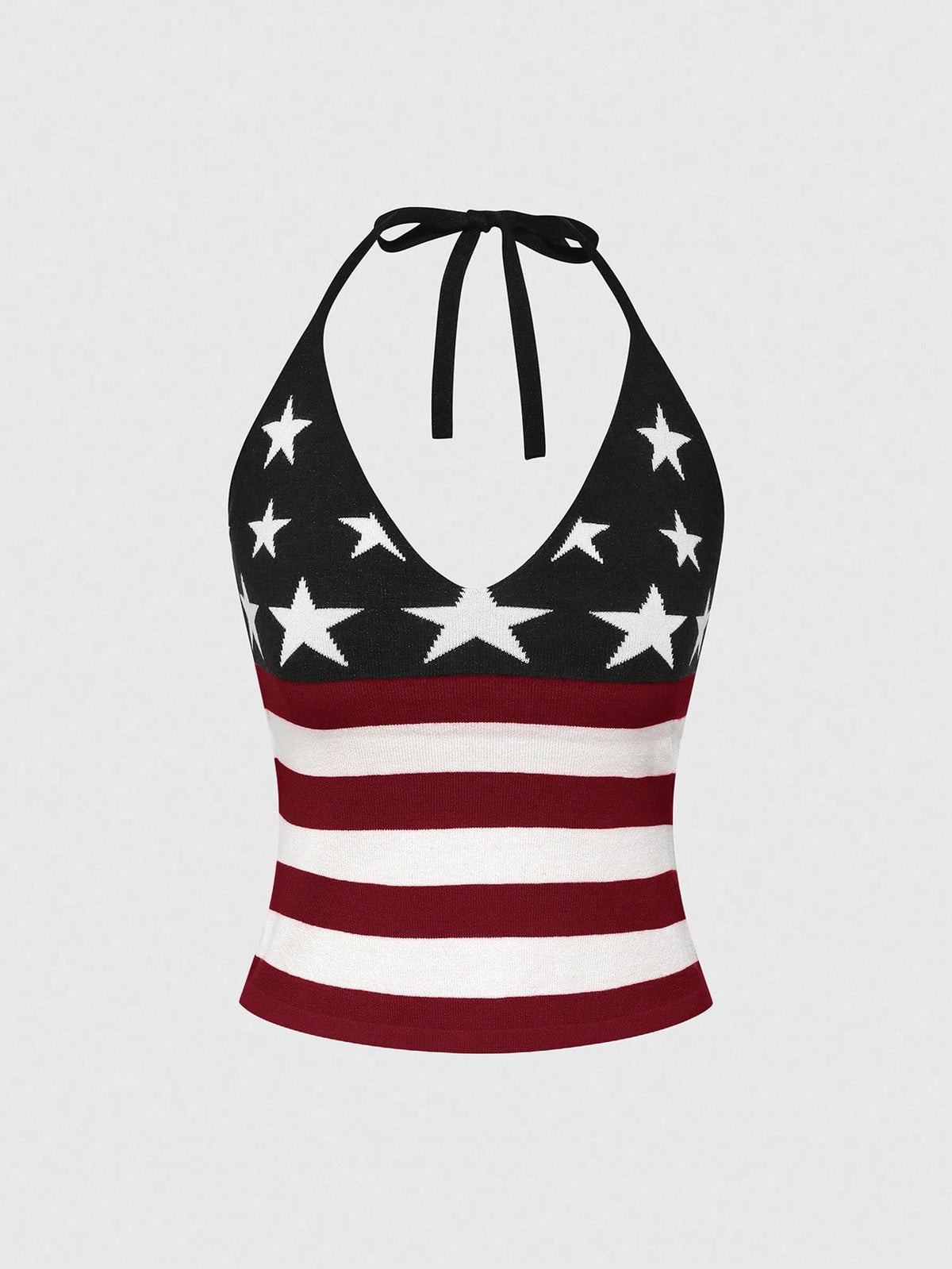 An apricot backless halter knit crop top featuring an American flag print, tied with a back knot, styled for Independence Day and casual fashion.