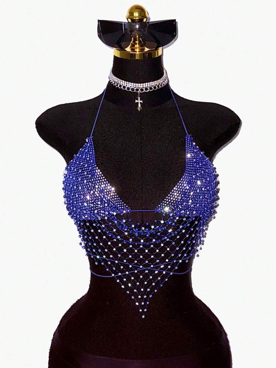Black sheer mesh halter top for women featuring rhinestone glitter effect, backless design, chain details, and an asymmetrical hem.