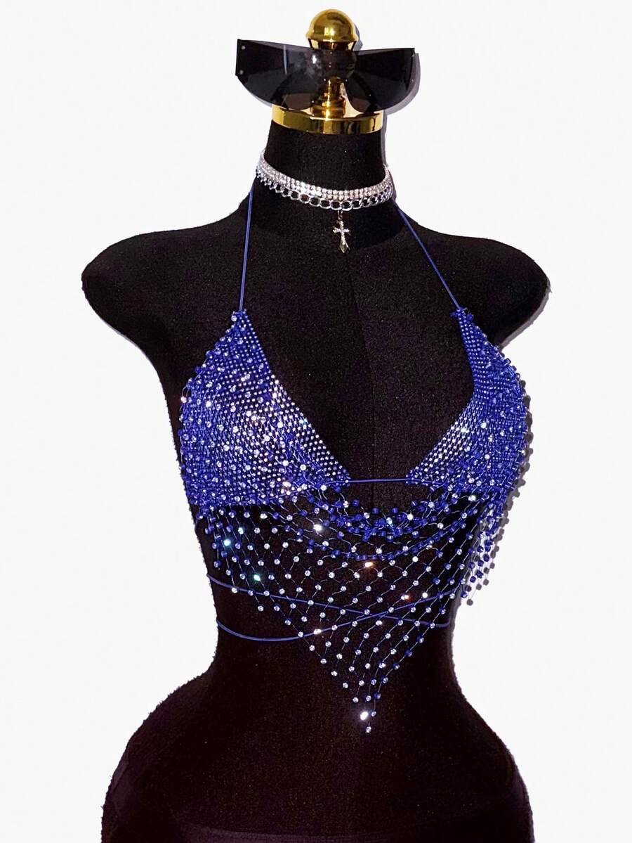 Black sheer mesh halter top for women featuring rhinestone glitter effect, backless design, chain details, and an asymmetrical hem.