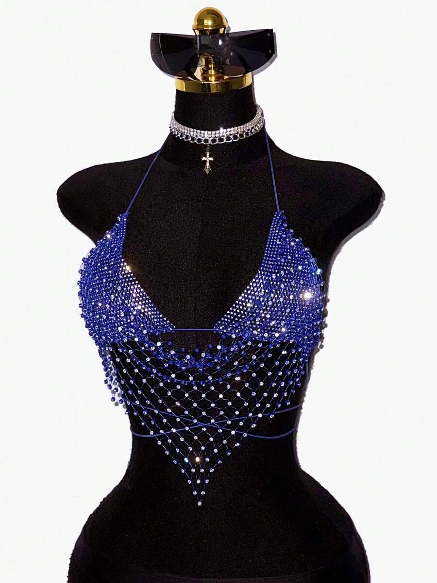 Black sheer mesh halter top for women featuring rhinestone glitter effect, backless design, chain details, and an asymmetrical hem.