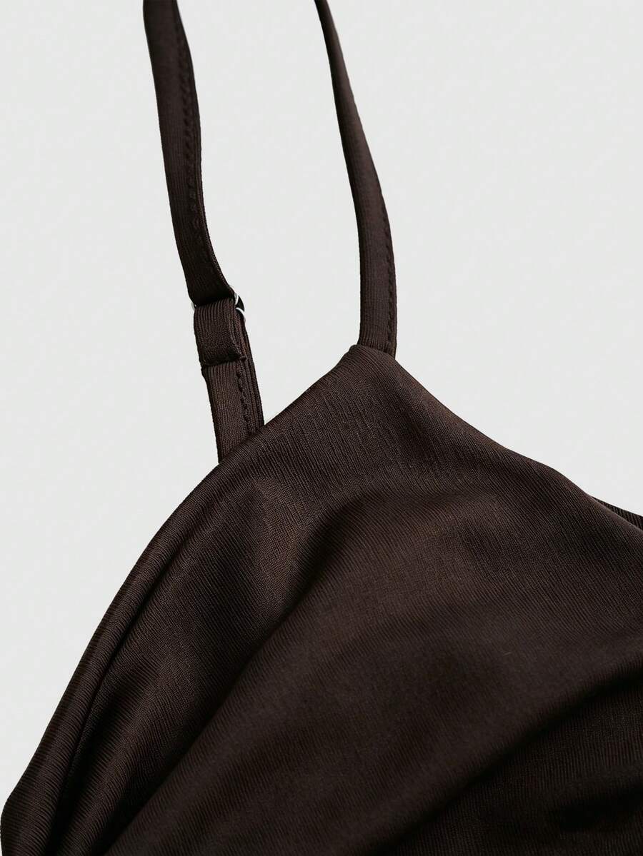 Women's coffee cowl neck cami dress with contrast lace patchwork, spaghetti straps, and an asymmetrical hem.
