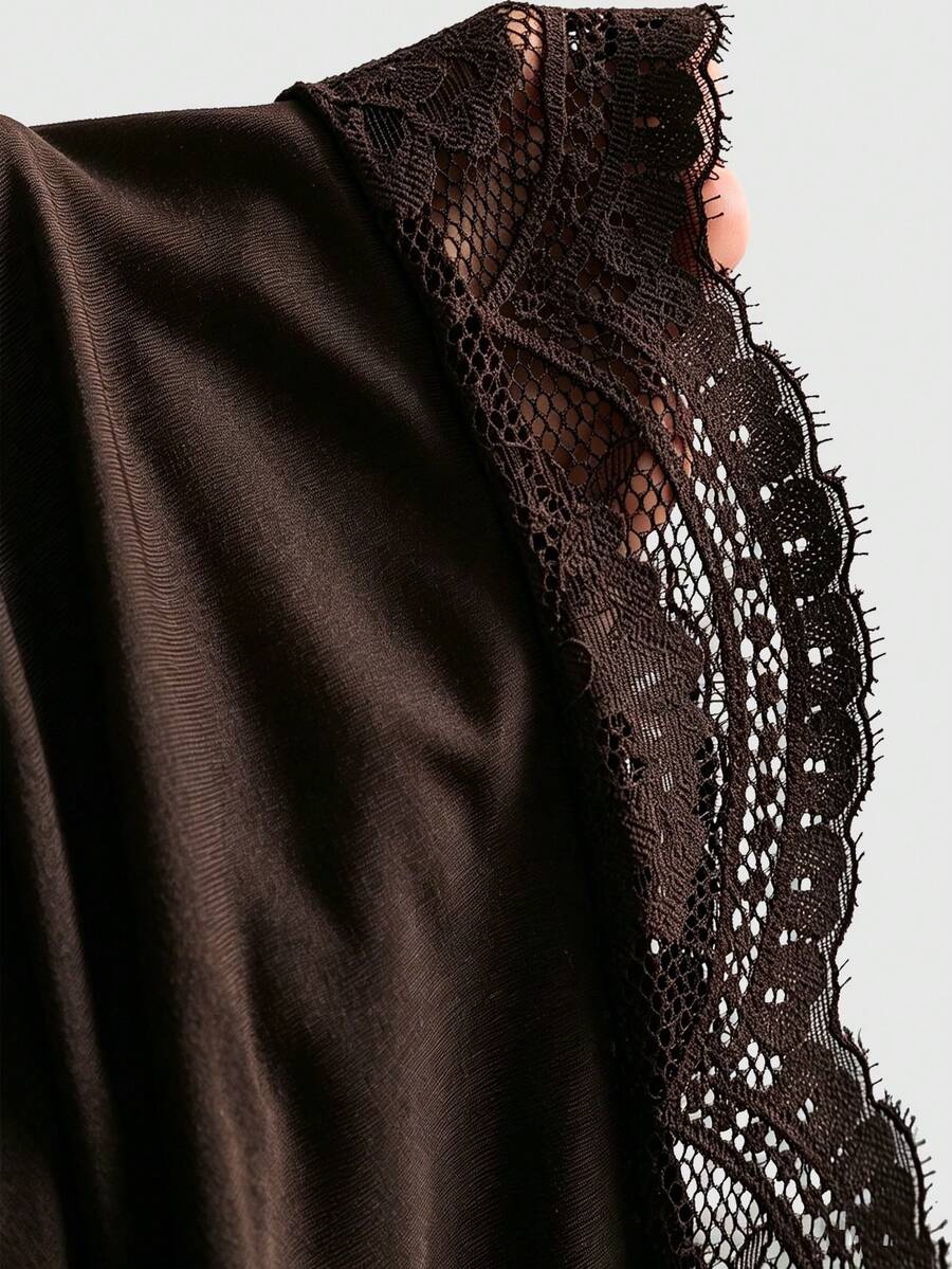 Women's coffee cowl neck cami dress with contrast lace patchwork, spaghetti straps, and an asymmetrical hem.