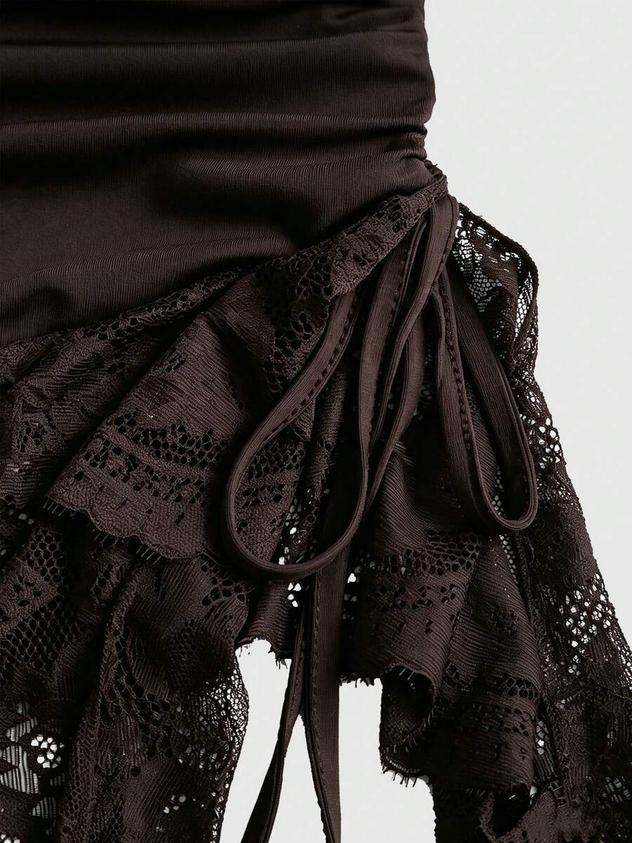 Women's coffee cowl neck cami dress with contrast lace patchwork, spaghetti straps, and an asymmetrical hem.
